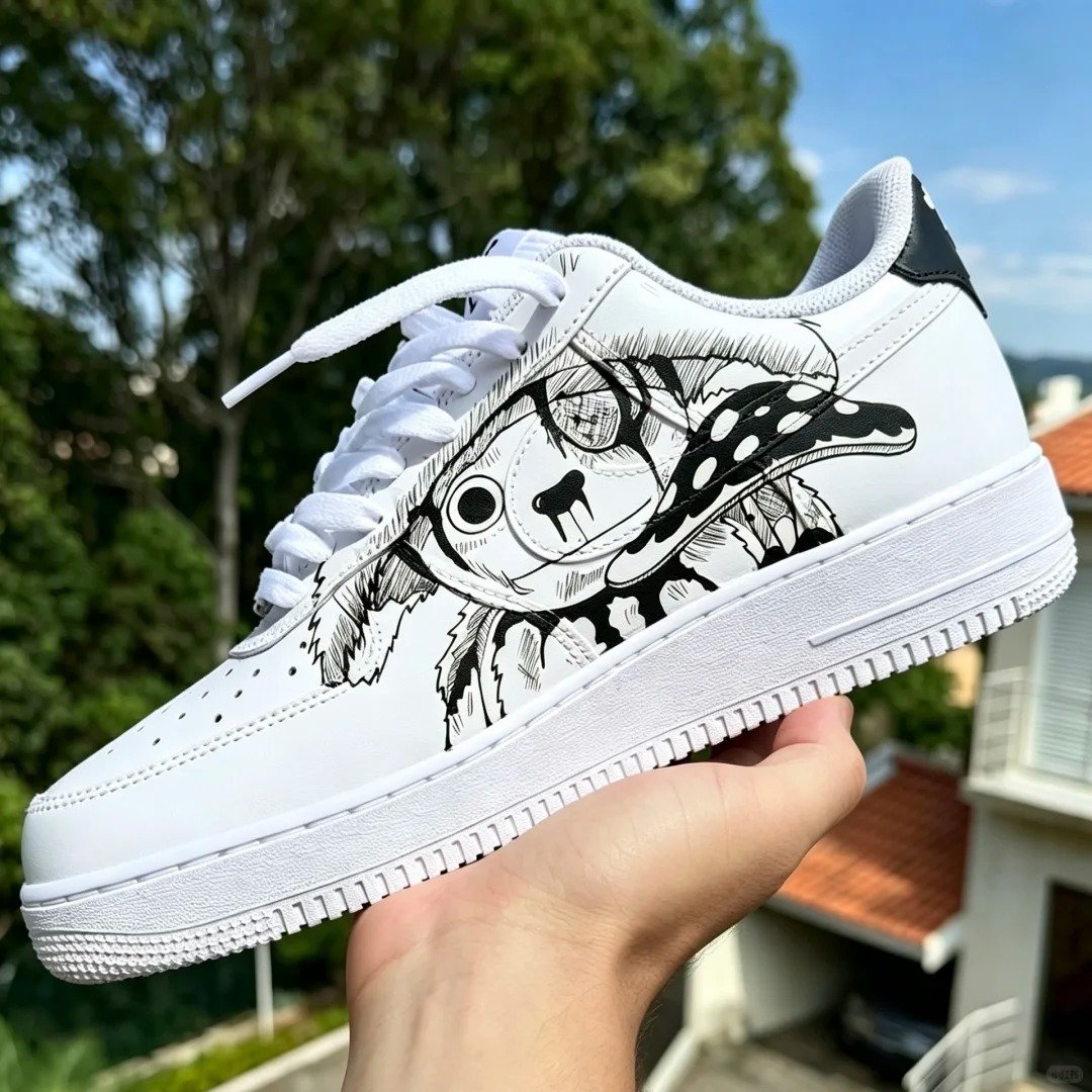 Hand-painted manga line art on white leather sneakers