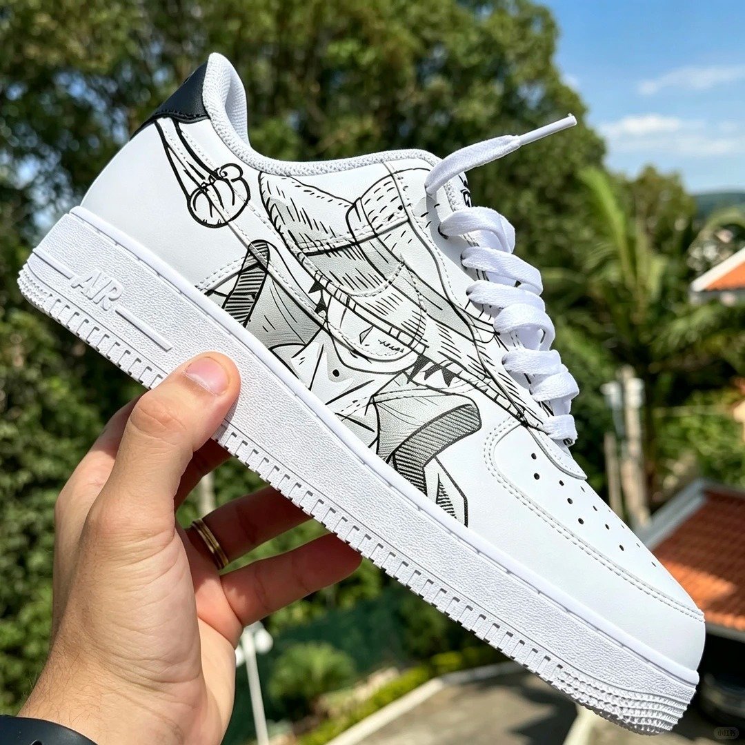 Close-up of hand-painted ink artwork on white sneakers